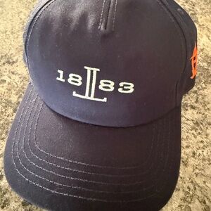 Lucchese Navy and Orange Cap from the Houston Livestock and Rodeo 2025